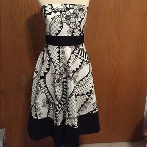 Black and white strapless dress.