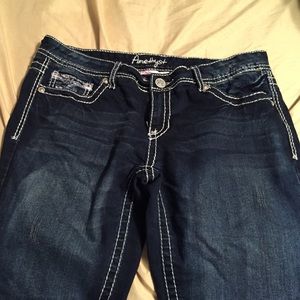 Dark blue jeans with white stitching