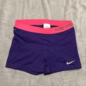 Purple and pink Nike Pros