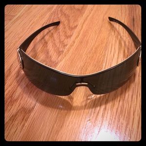 Authentic GUCCI sunglasses black and gold detail.