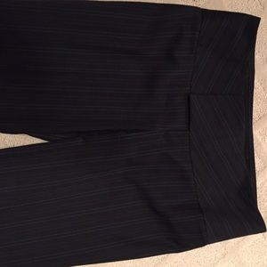 Black pants with white and red pinstripes