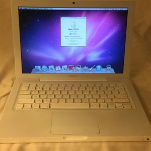 White 13 inch MacBook with charger