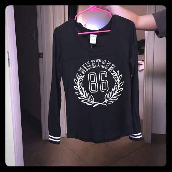 This is a cute black long sleeve Pink shirt.