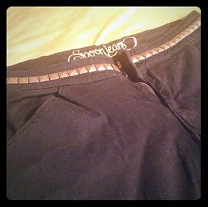 Black flares with gold studs around waist