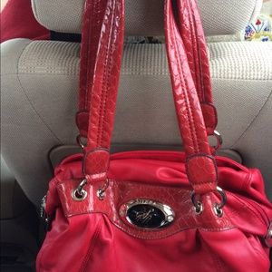 Red Sienna Ricchi shoulder purse.