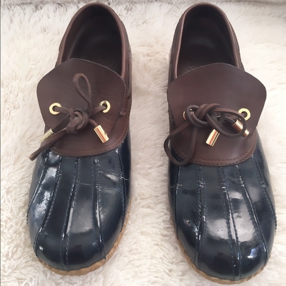 Navy blue patent leather & brown duck shoes.