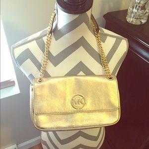 Brand new Michael Kors gold clutch