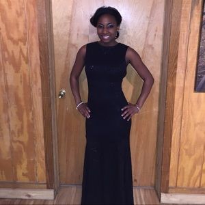 Black floor length gown with open back