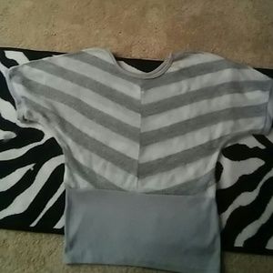 White and gray shirt.