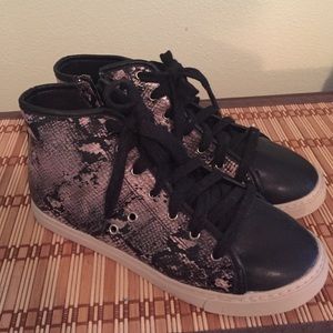 Sneakers with reptile texture.