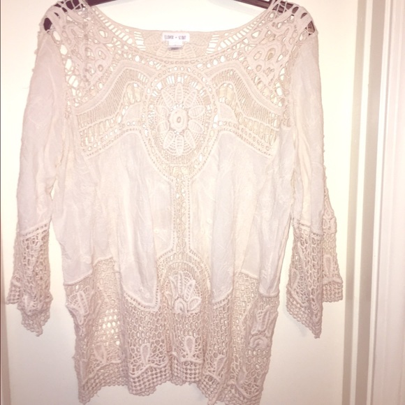 A cream lace top never worn