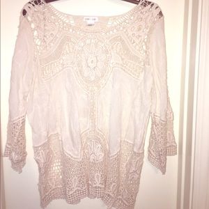 A cream lace top never worn