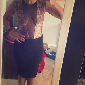 Nude and Black one piece with see through middle.
