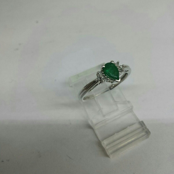 White gold emerald and diamond ring.