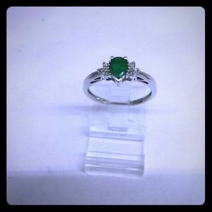 White gold emerald and diamond ring.