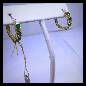 Yellow gold emerald and diamond earrings.