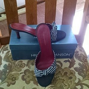 Black and white striped fabric peep toe shoes.