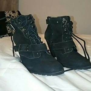 Steve Madden lace-up heeled boots.