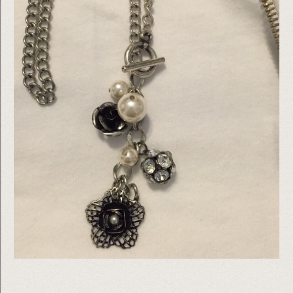 Jewelry - Collection of bobbles on a toggle chain .