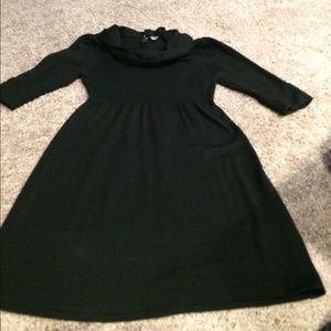 Black three-quarter length sweater dress.