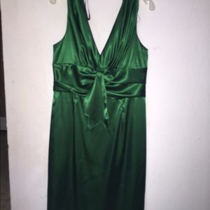Green dress. Knee length.