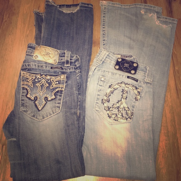Two pairs of worn out miss me jeans