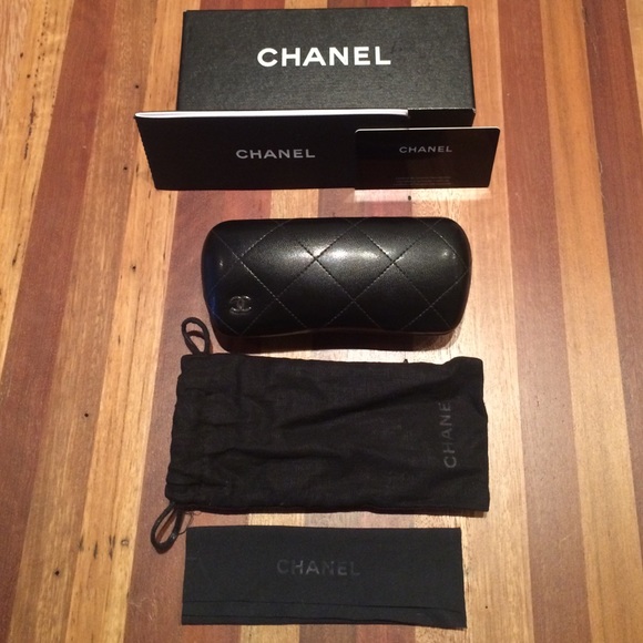 Chanel black rimmed eyeglasses.