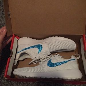 Blue and white nike roshes