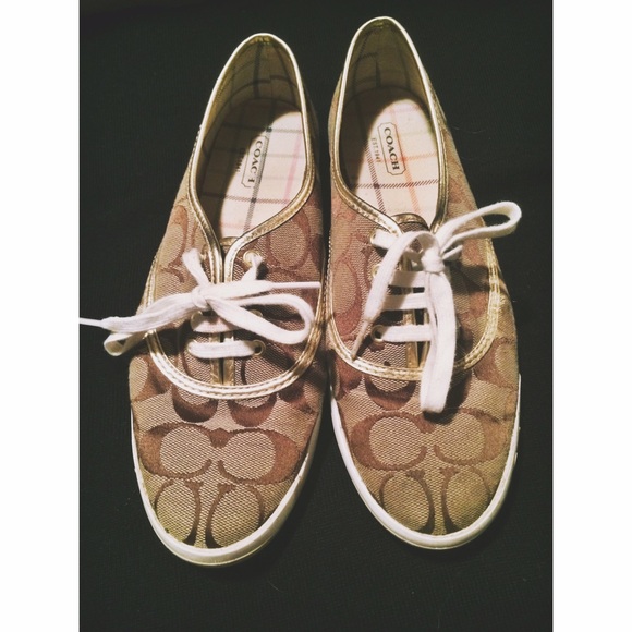 Gold Coach tennis shoes.
