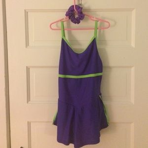 Purple and green figure skating outfit