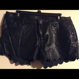 New black leather look shorts. Some stretch sz 11