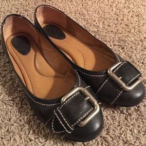 Black with silver buckle flats.