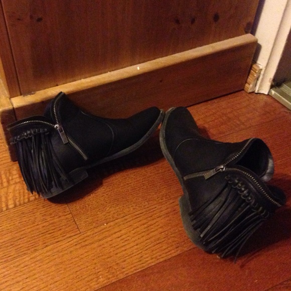 Side zip black leather ankle boots.