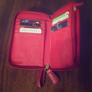 Red coach wristlet holds 12 cards & an iPhone 5