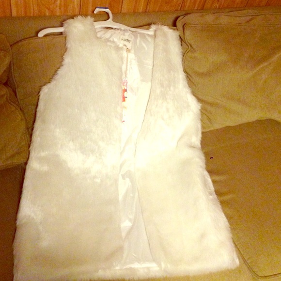 White fur vest