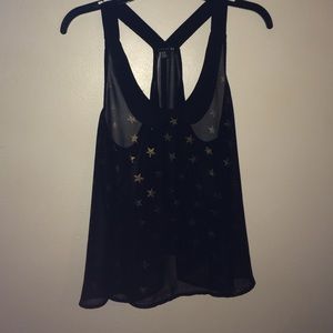 Sheer black top with gold stars on it.Size medium.