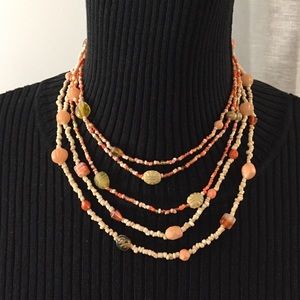 Two long strands of pastel shells & beads.