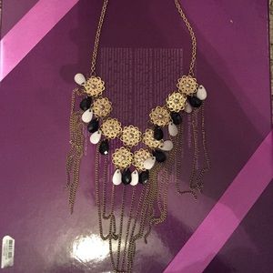 Gold, white, and black necklace