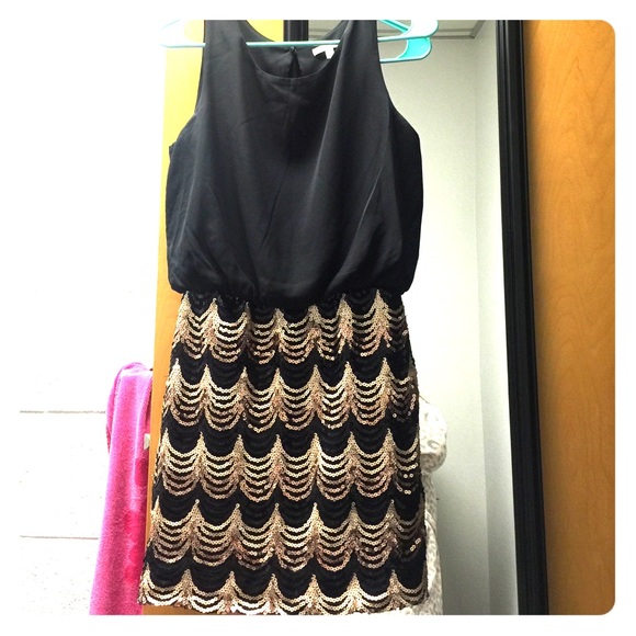 Black cocktail tank strap dress with sequin skirt