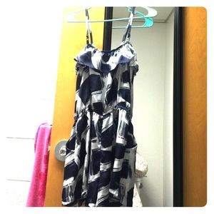 A navy and white romper with spaghetti straps