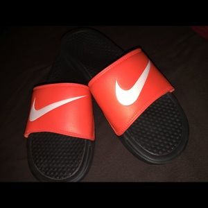 Neon orange Nike sandals