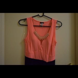 Peach and black cocktail dress.