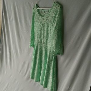 Lace light green dress with small cutouts in lace