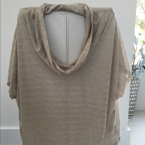 Cream and silver Jennifer Lopez swoop neck shirt.