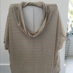 Cream and silver Jennifer Lopez swoop neck shirt.