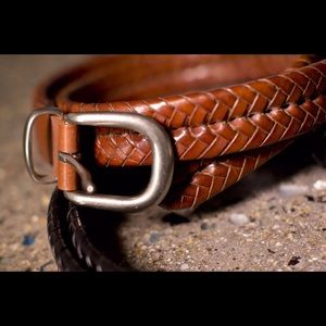 Authentic men's woven Coach belts.