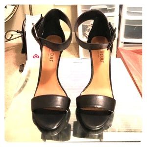 Black stiletto open toe and ankle belt at the top