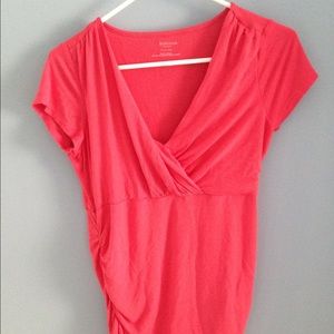 Coral maternity blouse.
