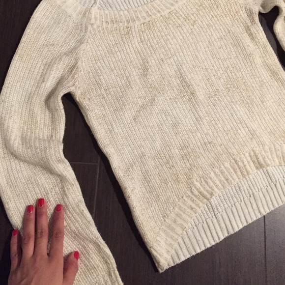 White/Cream sweater with gold tones.