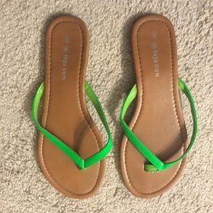 Flip flops with green straps